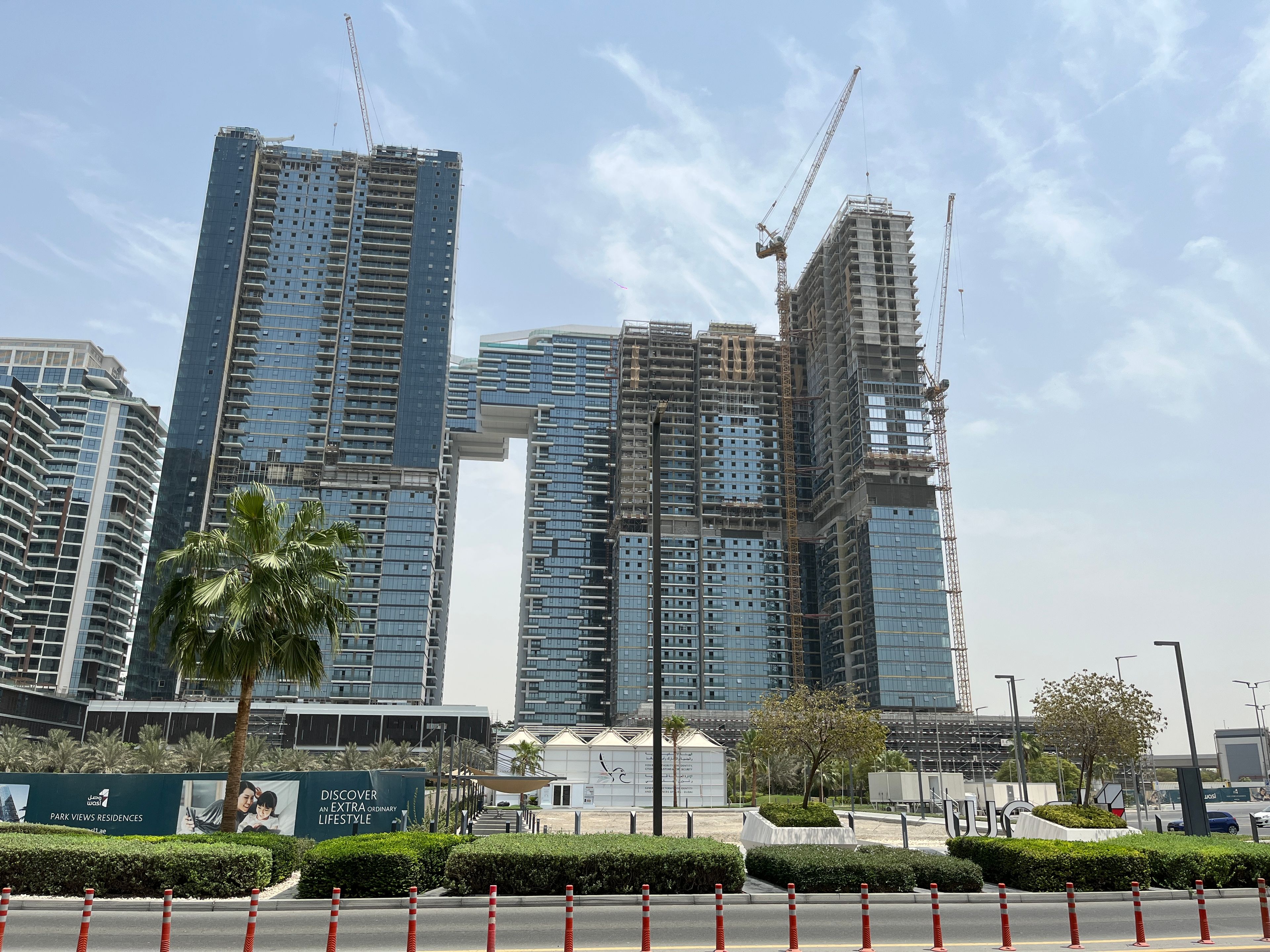High-rise towers under construction with cranes