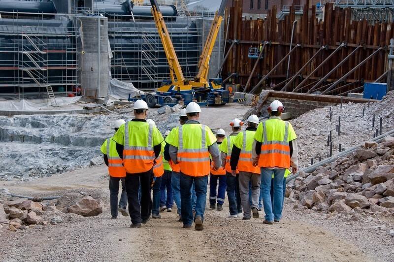 Construction team walking onto site